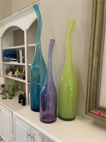 Collection of Colored Glass Bottles with Curved Necks
