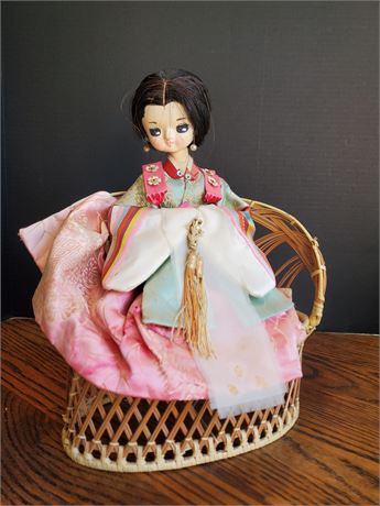 Vintage Geisha Doll on Wicker Loveseat